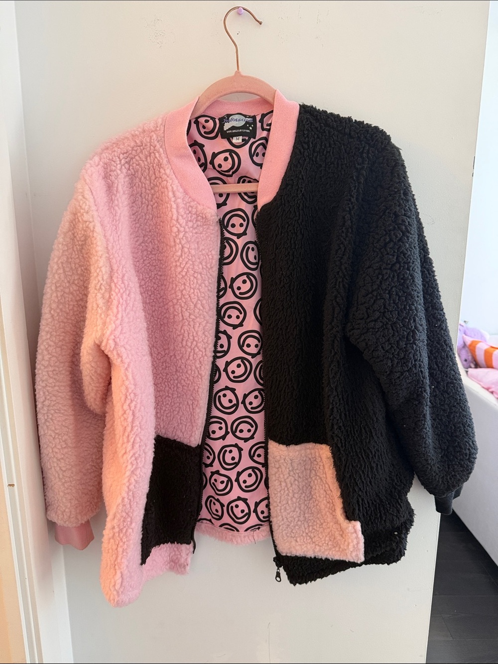 split pink and black Sherpa jacket